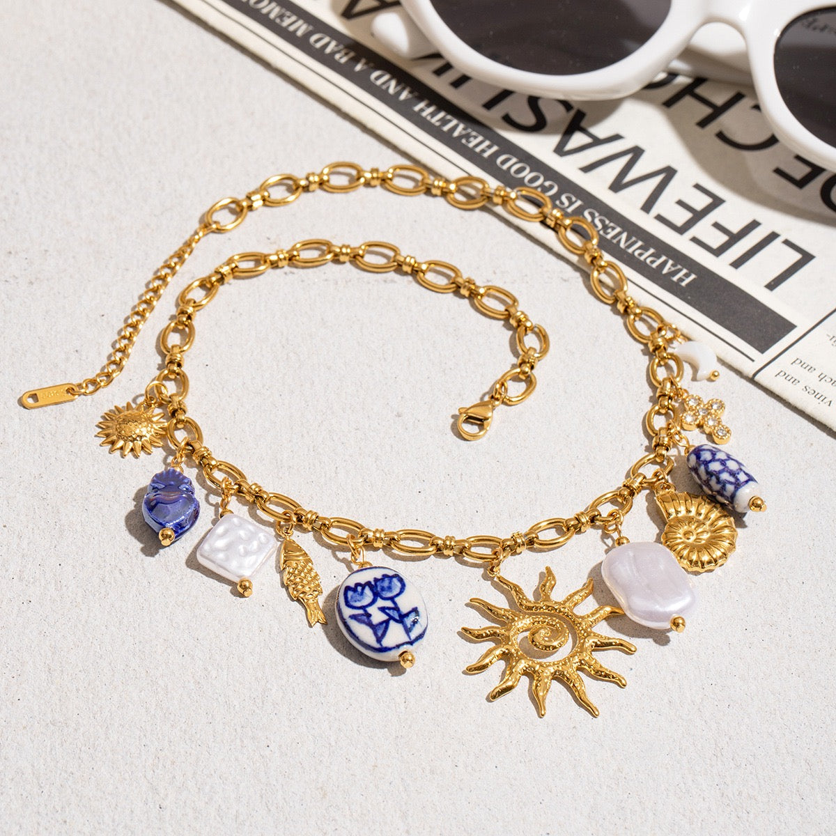 A fish basking in the sun on the beach Multi Charm Necklace